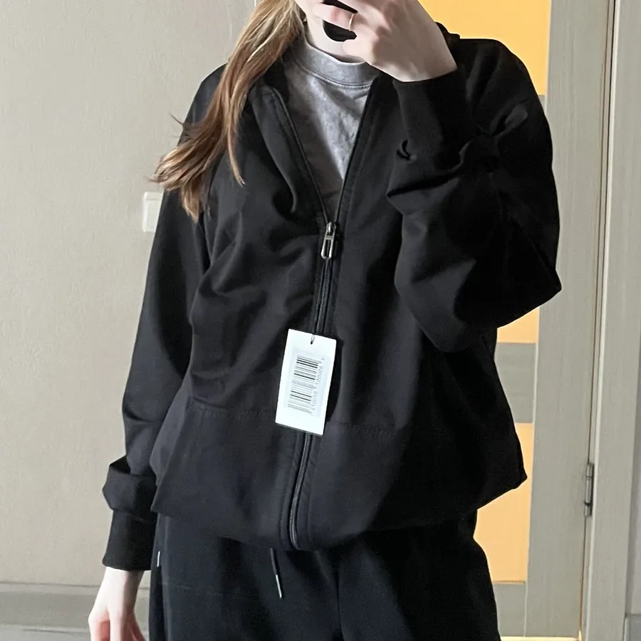 Black NAZZANI hoodie worn by a customer